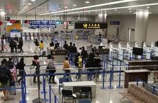 Passengers are screened at Shanghai Pudong International Airport in the wake of the new coronavirus.